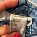 Really ripped jeans! Lol. Both legs ripped up but stylish. Blue Size 2 Photo 2