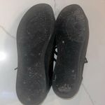 Guess Beautiful black and gold flat tennis shoes size 9 with gold triangle logo Photo 8