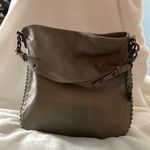 Jessica Simpson Bag with Studs and signature feather. Photo 1