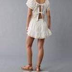 American Eagle High-Waisted Embroidered Eyelet Mini Skirt Photo 1