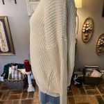 Umgee  cream colored v-neck lace up back long sleeve sweater. Photo 5
