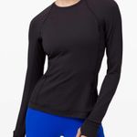 Lululemon black raw edge flowy top warm with small side slits Photo 0