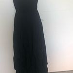 Hemline Black strapless dress with draped . Photo 25