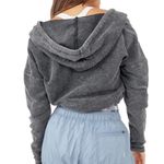 Free People Movement black criss cross cropped hooded terry sweatshirt Photo 2