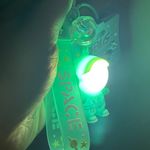 Cute cartoon Astronaut with the sunset light keychain Green Photo 0