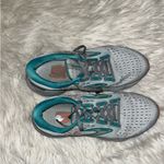 Brooks Women's Glycerin 20 neutral running shoe in a light gray, teal, and coral Photo 9