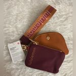 Lululemon  athletica Burgundy and Tan Wristlet Photo 0