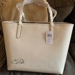Coach Authentic Pebbled leather/signature coated canvas Cruella snap magnet tote Photo 2