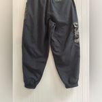 Nike  Sportwear Icon Clash Pants in Black Zippered Leg Pocket Detail Size M Photo 9