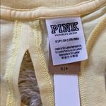 PINK - Victoria's Secret NWT
PINK Yellow Black Lettered Tank Top Photo 4
