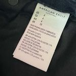 American Eagle • Distressed Washed Black Button Fly Super High Rise Shorties Photo 5