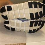 on cloud On Running Cloudtec Sneakers in Black, Gray, and Purple Photo 3