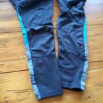 Tangerine 🌸3 for $20🌸 Leggings with venting mesh, color stripe and zipper pocket s… Photo 1