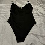 Elegant Black One Piece Swimsuit with High Photo 1