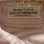 Levi's 721-PINK HIGH RISE-SIZE 25 Light pink high rise skinny jeans, excellent condition Measurements: Waist: side to side 13 inches Inseam: 29 inches Rise: 9 1/2 inches Photo 11