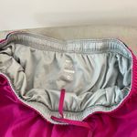 Nike dri-fit magenta lined running shorts size medium Photo 4