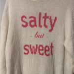 Wooden Ships  Cream Sweater with Pink Text “Salty but Sweet” in size M/L Photo 1