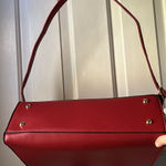 London Fog red faux leather. Adjustable strap and handles. GUC Photo 3