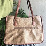 GUESS brown and tan tote monogram hand shoulder bag purse. Some wear as pictured. Great for work school college university. Can fit most books laptops. Photo 1