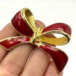 AAI red enamel and gold tone bow brooch Photo 1