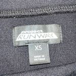 Project runway black pencil skirt with grommet and lace on bottom front side Size XS Photo 3