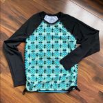 Title Nine  Rash Guard Side Scrunch Tie Black and Blue Two Sided Geometric Shapes Photo 0