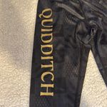 Warner Bros Black and Gold Leggings with Tapered Design Size XS Photo 3