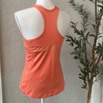 Nike Women’s Classic Racerback Dri Fit Athletic Tank in Orange Size Medium Photo 3