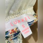 Luxxel  Women’s romper size small 
Full of Bloom Romper flower print Photo 10