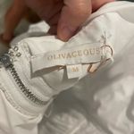 Olivaceous white halter tie romper with cutouts Photo 4