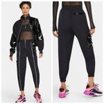 Nike  Sportwear Icon Clash Pants in Black Zippered Leg Pocket Detail Size M Photo 1