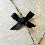 Gold tone love letters bow necklace Photo 2