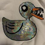 Disney XS Nightmare Before Christmas Undead Duck Sequin Flip Hoodie Photo 3