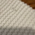 White Cardigan Sweater with Black Heart Design Photo 2