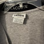 Lacoste long sleeve sweater is a Men's size Large. Photo 4