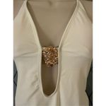 Plunge halter neck thong one piece swimsuit with metal shell medallion cream ivo Photo 1