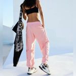 Free People Movement FP Movement Mesmerize Me Cargo Pants barrel dance low rise neon peach dance cuff Photo 3