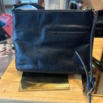 Isaac Mizrahi Crossbody black bag. It appears to have never been used. Photo 1