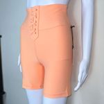 We Wore What  Solid Lace Up Biker in Peach Cobbler Photo 10