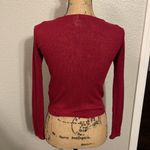 Divided Raspberry colored long sleeve shirt with lace up front. Photo 3