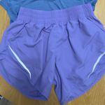 Champion Women's Short Sleeve Tees - Pink and Blue and purple shorts. Photo 1