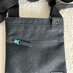 Dakine  Canvas Crossbody Bag Black Slim Profile Photo 3