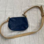 Charming Charlie small blue crossbody bag with tan strap. Photo 0