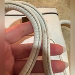 Tignanello White with Gold Signature lining Crossbody Bag with built in wallet. Photo 9