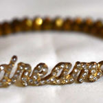 Source Unknown Flashy Rhinestone Accent"Dream" Beveled Gold Tone Beaded 6.5 Stretch Bracelet Photo 0