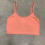 PINK - Victoria's Secret Victoria’s Secret PINK, crop top sports bra. Size M. Soft orange color. Photo 1