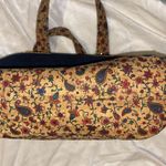 BLUE DENIM HANDBAG WITH FLORAL CORKLIKE DESIGN ON BOTTOM & HANDLES RED INTERIOR Photo 5