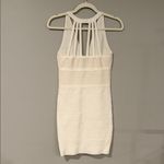 Bebe  vintage bandage dress in cream color with strappy details and gold hardware Photo 2