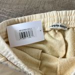 Dippin' Daisy's NWT Dippin’ Daisy’s Yellow Smile Sweatpants Size Small Photo 2