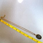 Like calls to Like gold tone and black starburst pendant necklace Photo 7